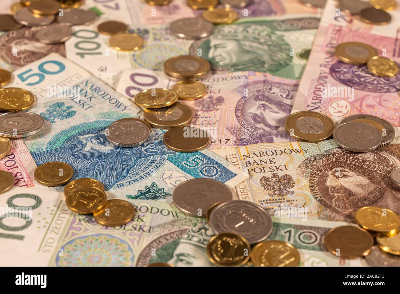 Polish Zloty. PLN banknotes and coins providing great options to be used for illustrating subjects as business, banking, media, presentations etc. Stock Photo