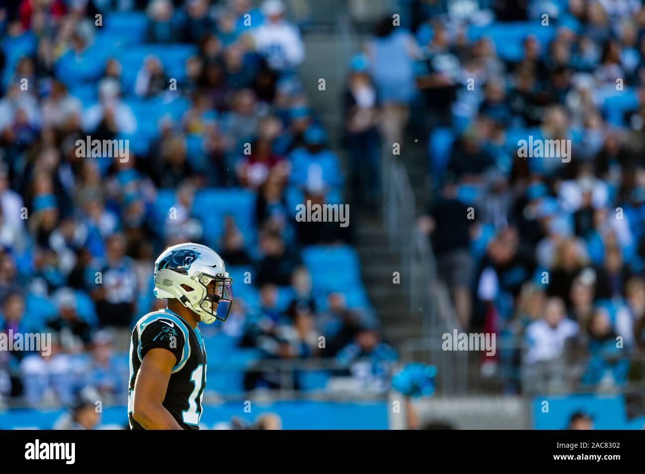 Carolina Panthers wide receiver DJ Moore leaps into the stands to break up  a fight between fans