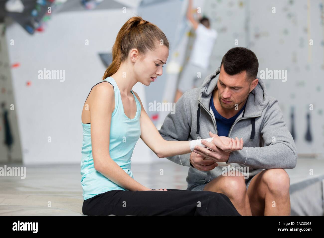 woman suffering wrist injury in indoor climbing center Stock Photo Alamy