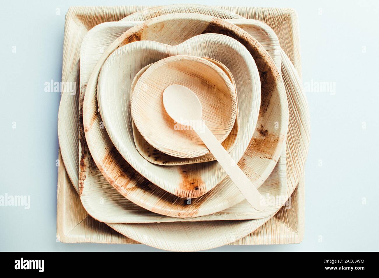 Stack of palm leaf based plates used for single use as party essential for a environment friendly plastic alternate solution Stock Photo