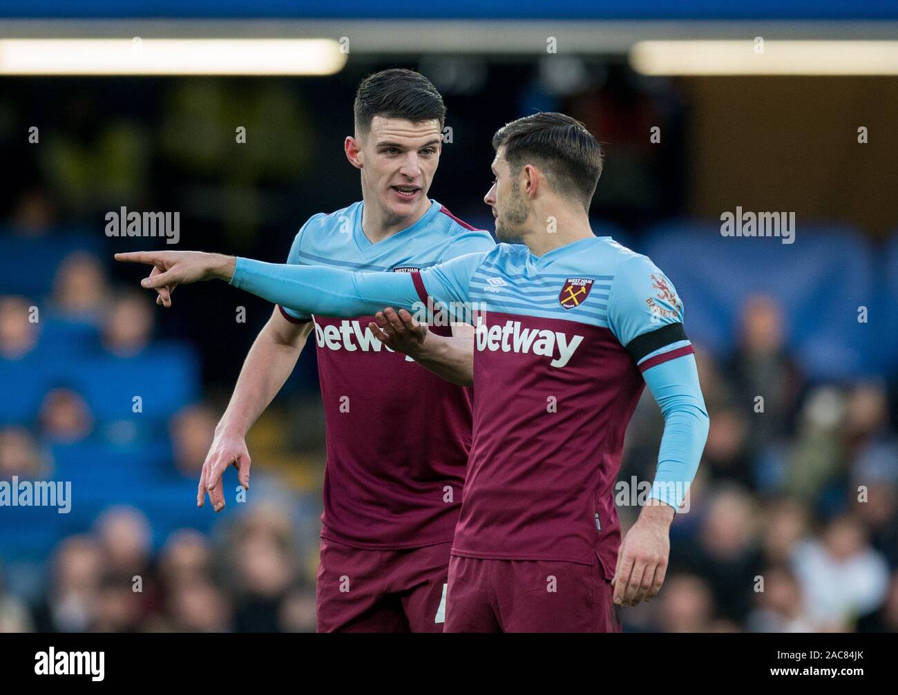Declan Rice & Aaron Cresswell of West Ham Utd during the Premier League match between Chelsea and West Ham United at Stamford Bridge, London, England Stock Photo