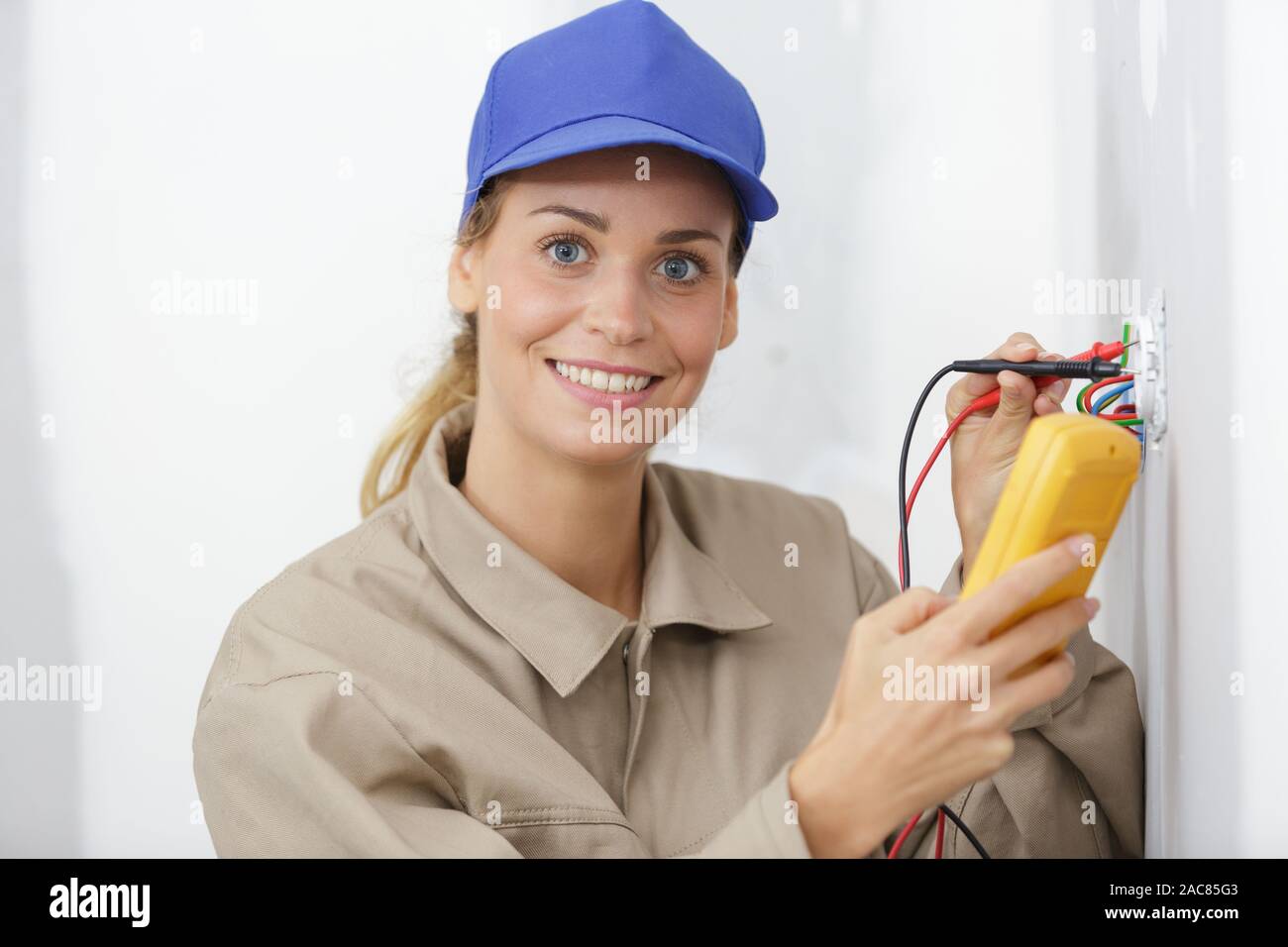 Female Electrician Testing A Wall Socket Stock Photo Alamy Female Electrician Testing A Wall Socket Stock Photo Alamy