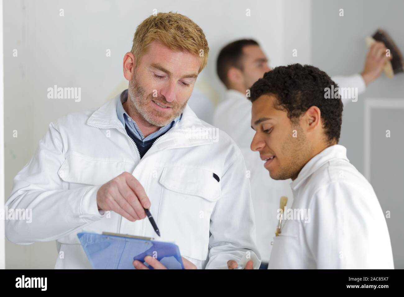 young apprentice painter in professional training Stock Photo