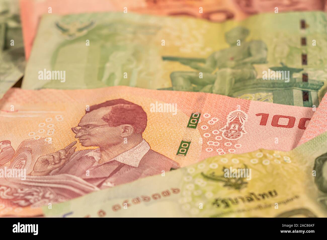 A composition of Thai baht. THB banknotes providing great options to be used for illustrating subjects as business, banking, media, etc. Stock Photo