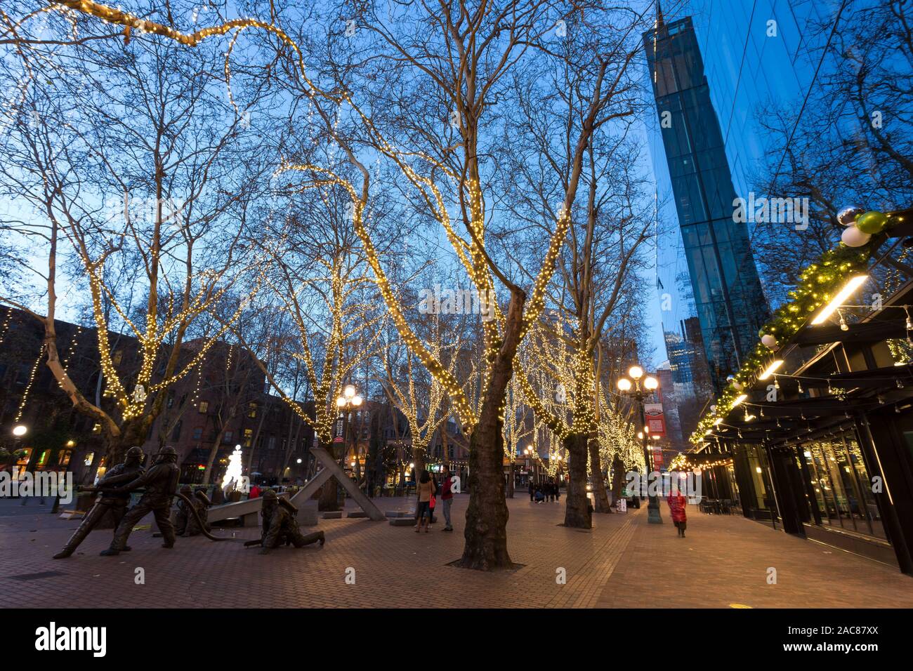 Holiday lights illuminate Occidental Square in Seattle's historic