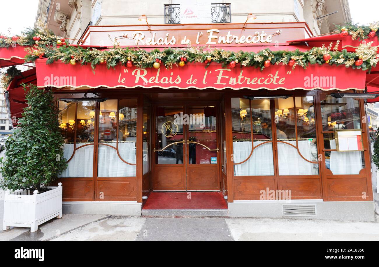 Le Relais de lEntrecote is traditional French restaurant decorated for Christmas. It located in historical centre of Paris near Champs Elysees avenue Stock Photo