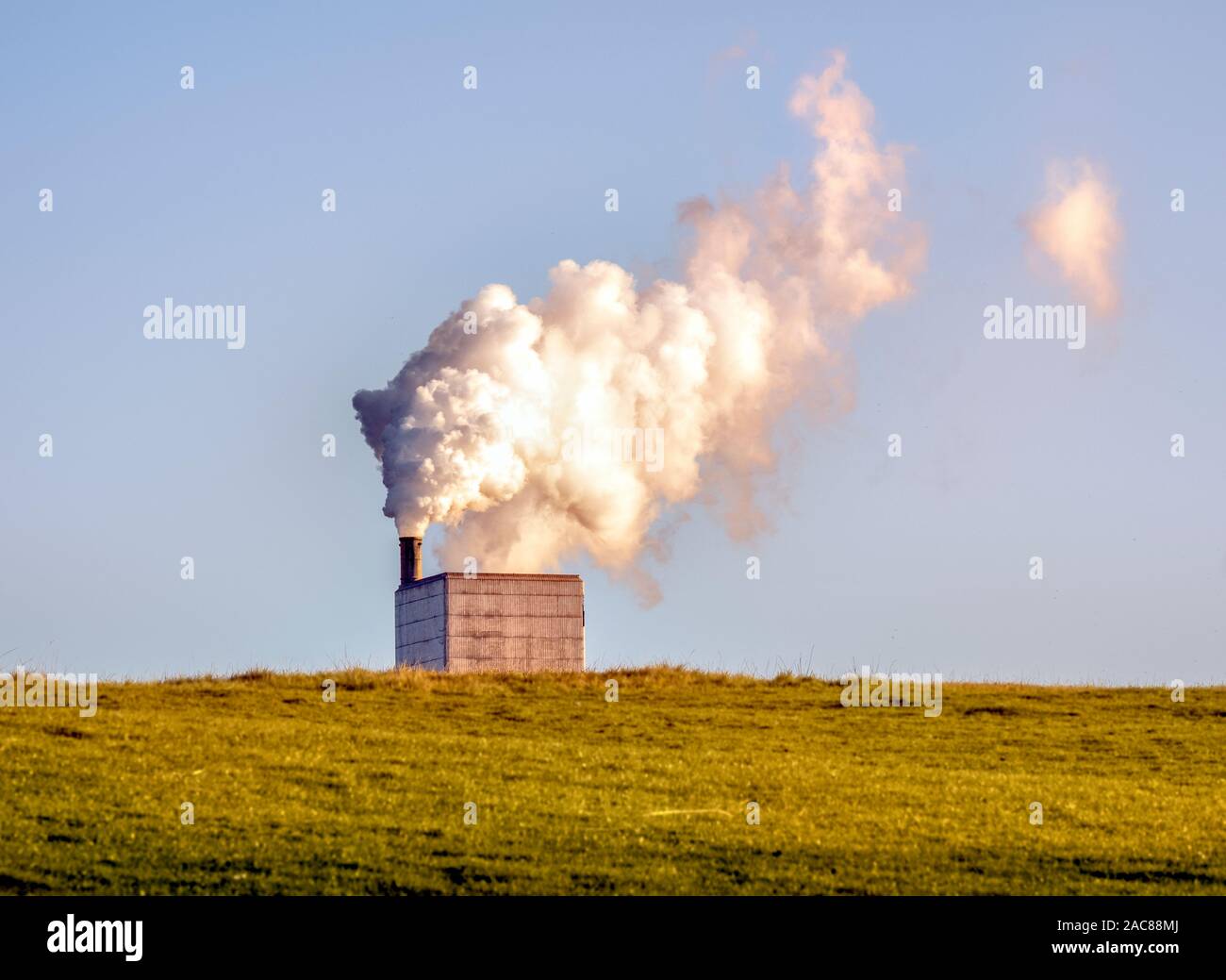 Chimney and water vapour plume at the Dunbar Cement Plant, Dunbar, East Lothian, Scotland, UK Stock Photo