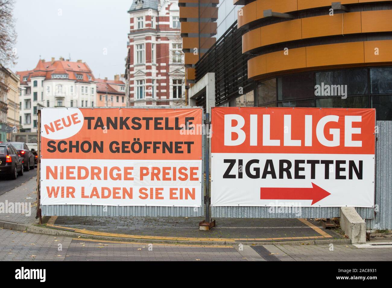 A Banner With Information About Cheap Cigarettes And A New Gas