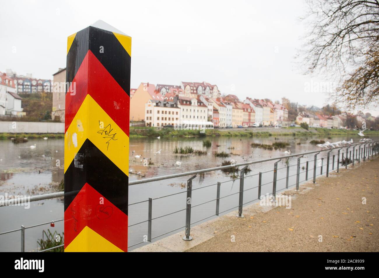 A border marker of Germany seen at the Lusatian Neisse in Goerlitz.Zgorzelec and Goerlitz are partner cities of the Euro region Neisse located in Saxony (Germany) and Lower Silesia (Poland) Stock Photo