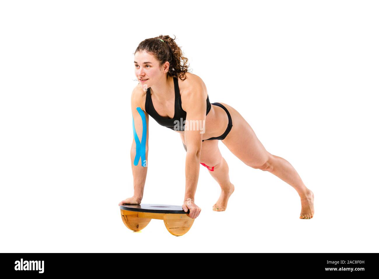 Kinesio tape girl, exercise push ups. Attractive Young sport Woman