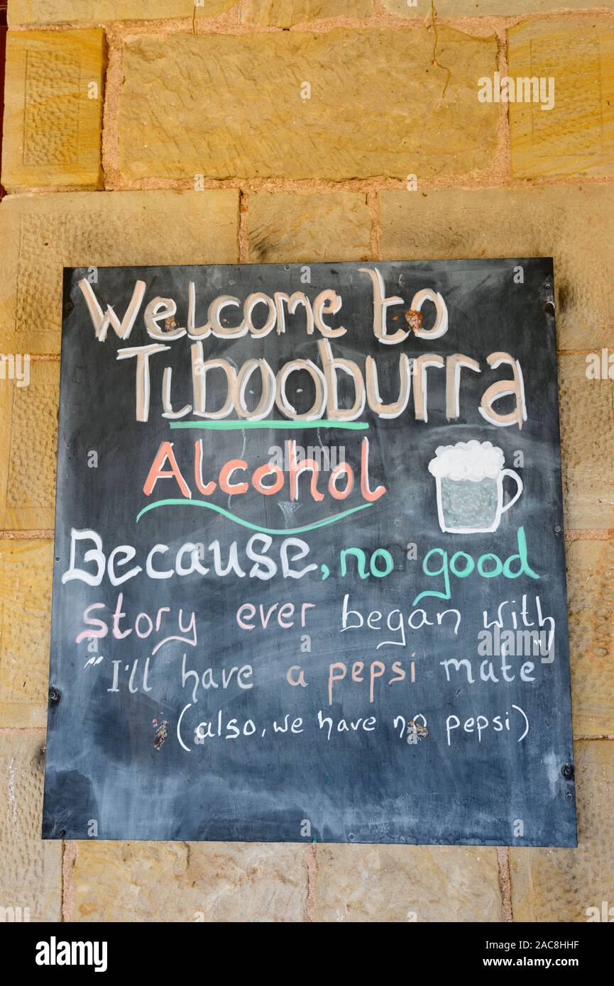 Humorous sign outside the bush pub 'The Family Hotel' in the remote Outback town of Tibooburra, New South Wales, Australia Stock Photo