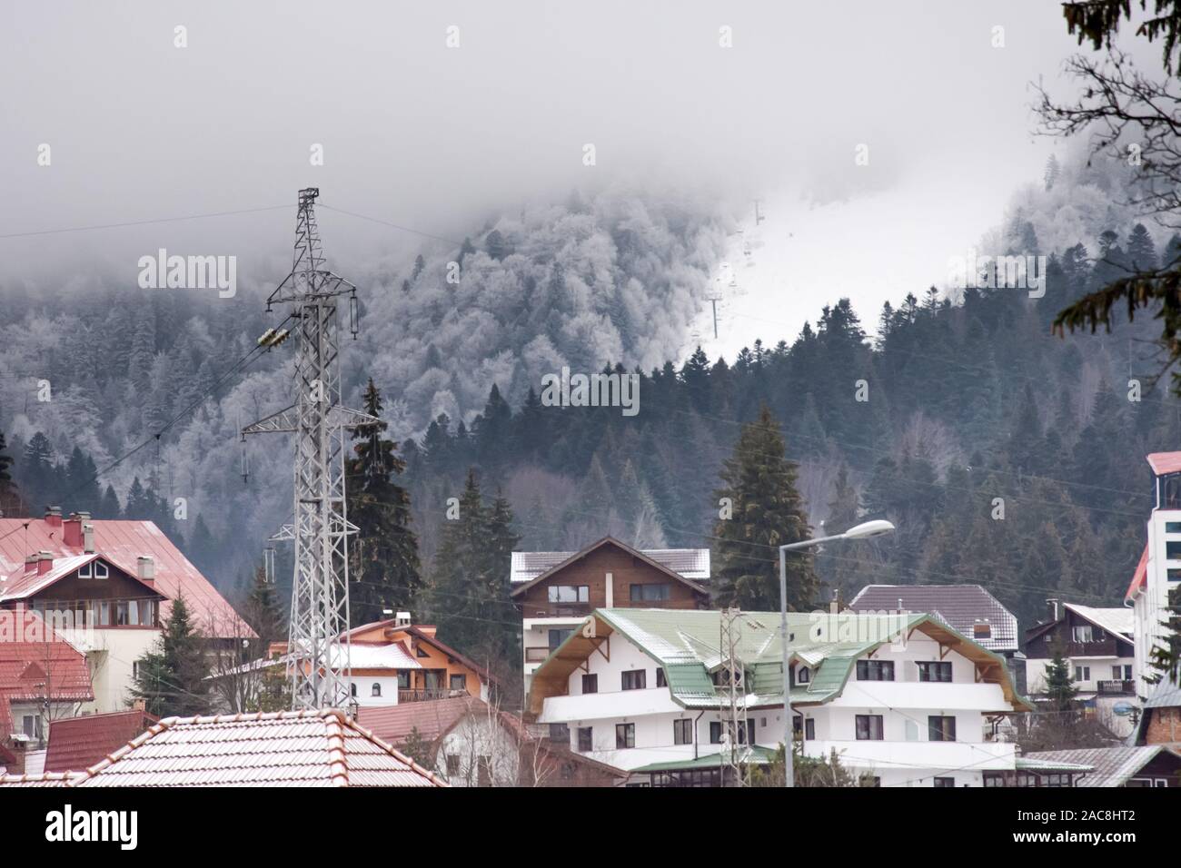Many different cottages at the foot of the mountain in the winter Stock ...