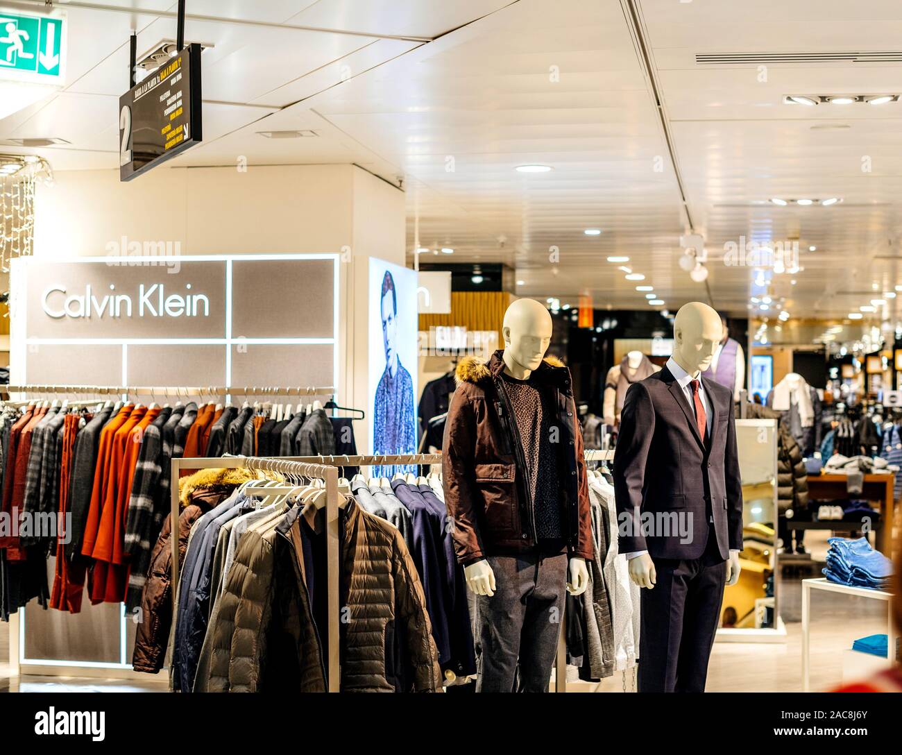 Barcelona, Spain - Nov 17, 2017: Front view of Two mannequins male silhouettes wearing luxury silk jackets costumes in upscale fashion clothes store Calvin Klein in El Corte Ingles Mall Stock Photo