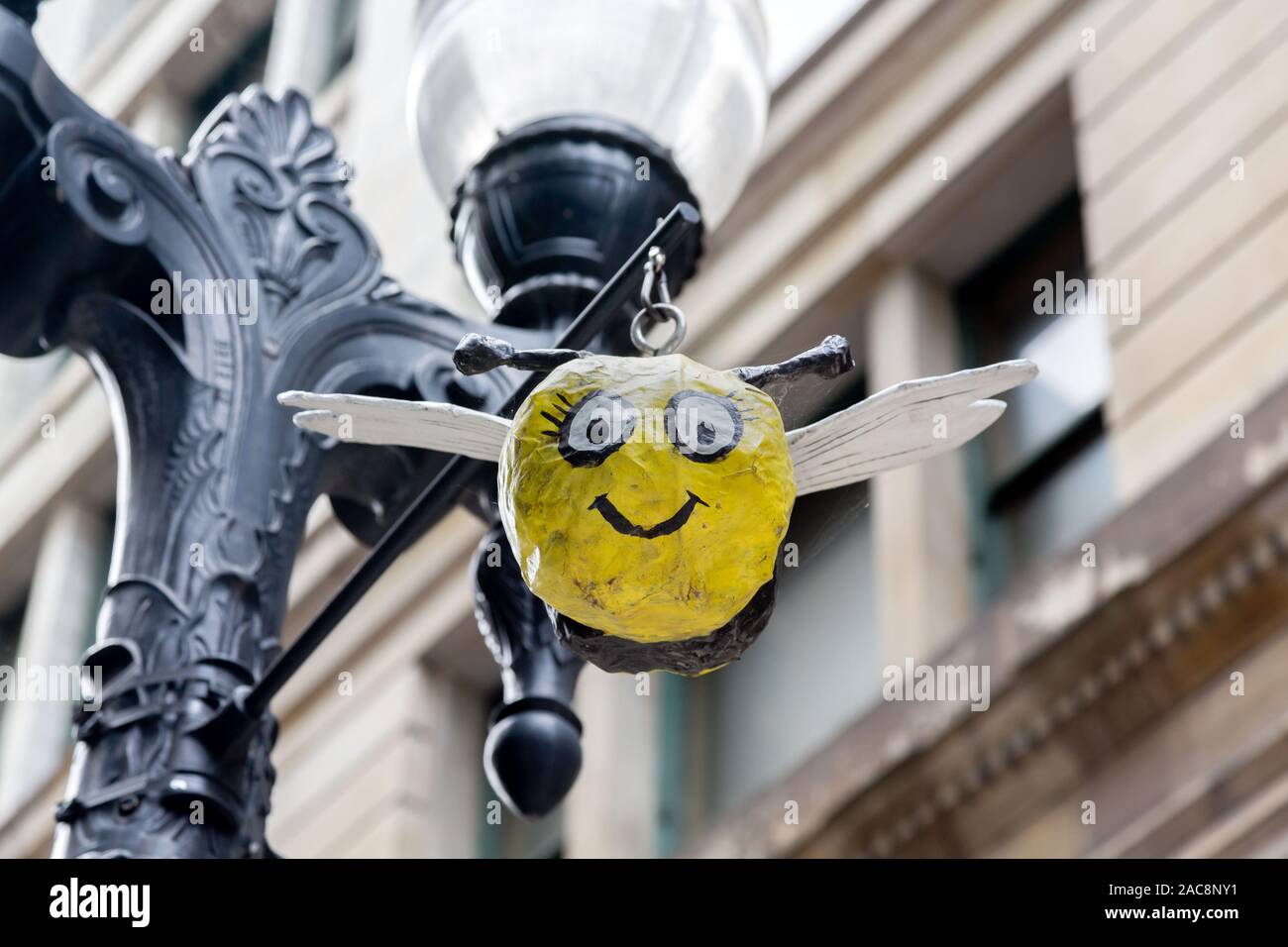 Paper Mache model hanging from streetlamp, Chicago, Illinois, USA Stock Photo
