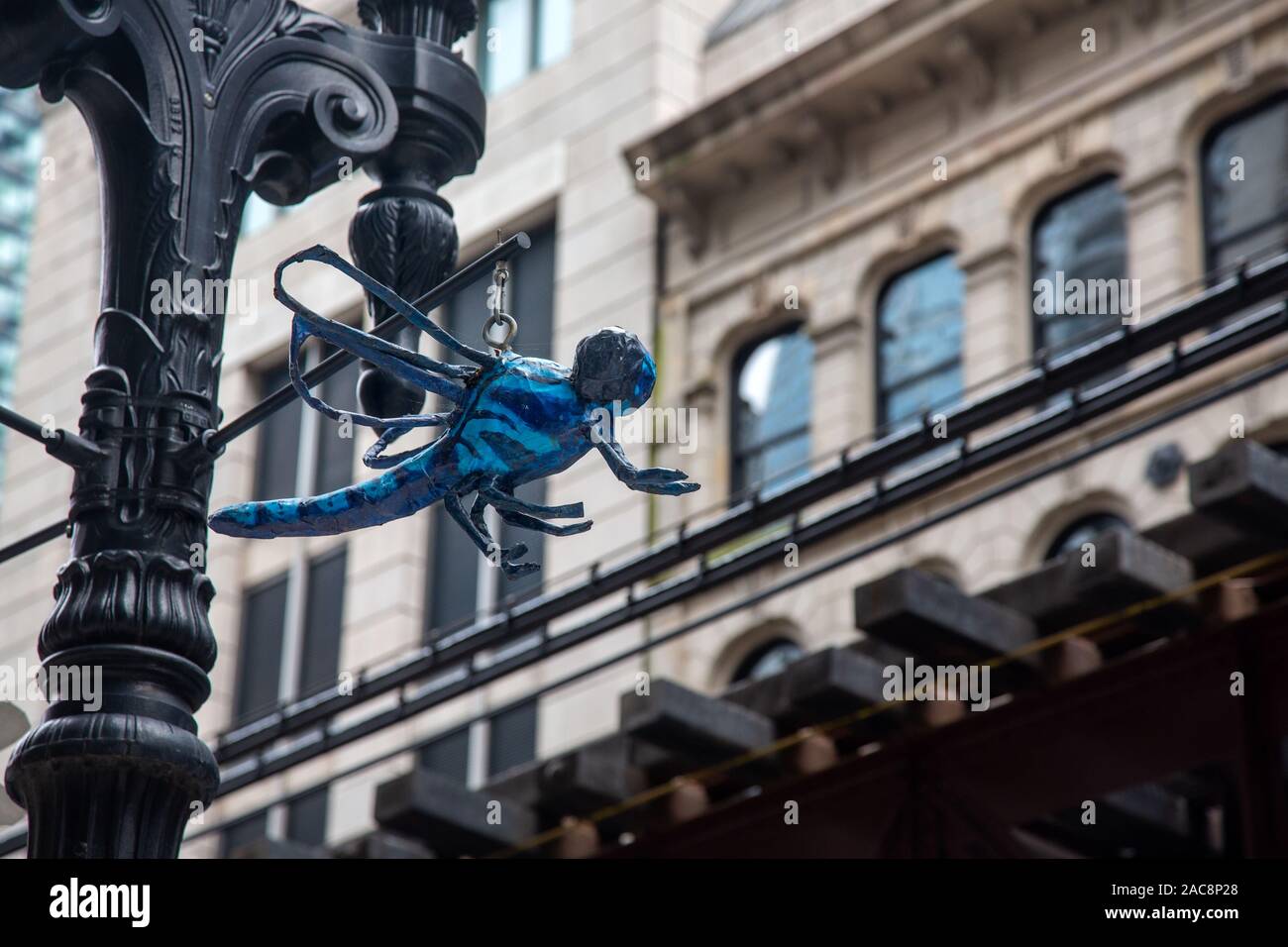 Paper Mache model hanging from streetlamp, Chicago, Illinois, USA Stock Photo