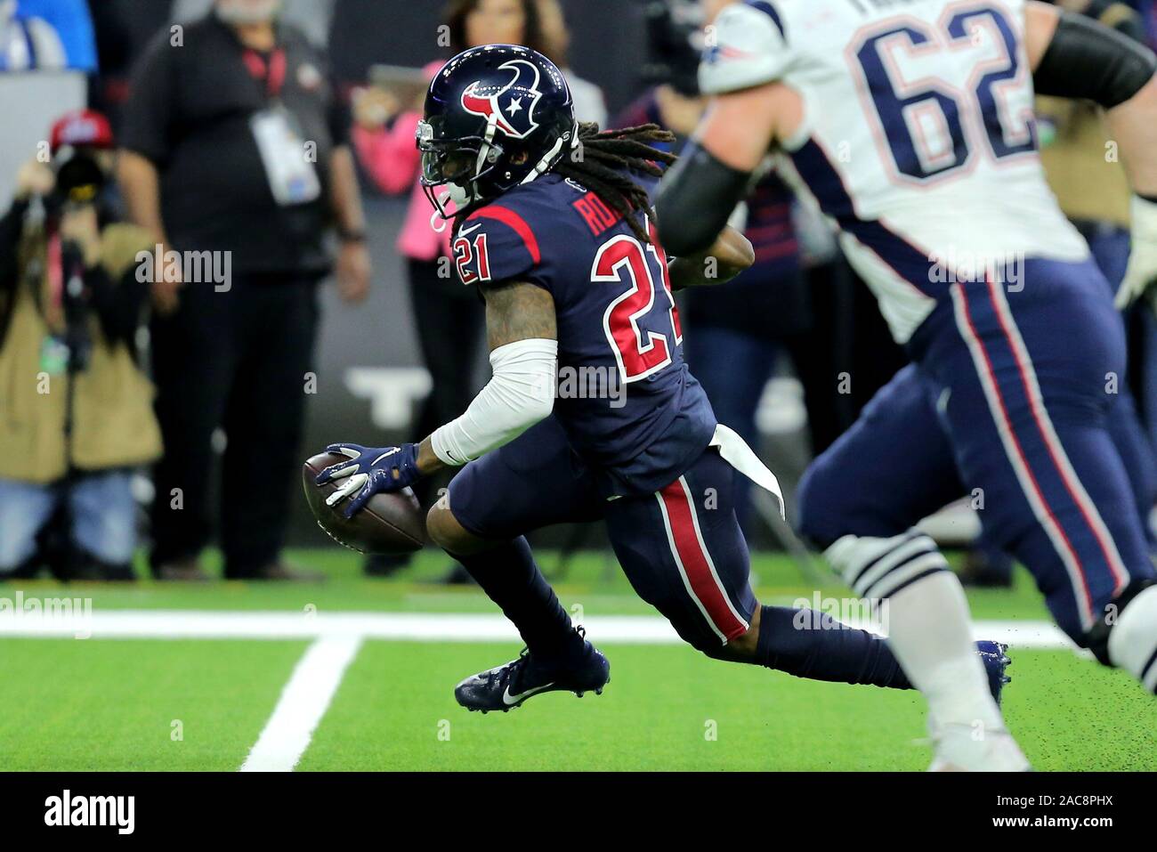 Houston, Texas, USA. 1st Dec, 2019. Houston Texans cornerback Bradley Roby (21) carries the ball upfield after an interception during the first quarter of the NFL regular season game between the Houston Texans and the New England Patriots at NRG Stadium in Houston, TX on December 1, 2019. Credit: Erik Williams/ZUMA Wire/Alamy Live News Stock Photo