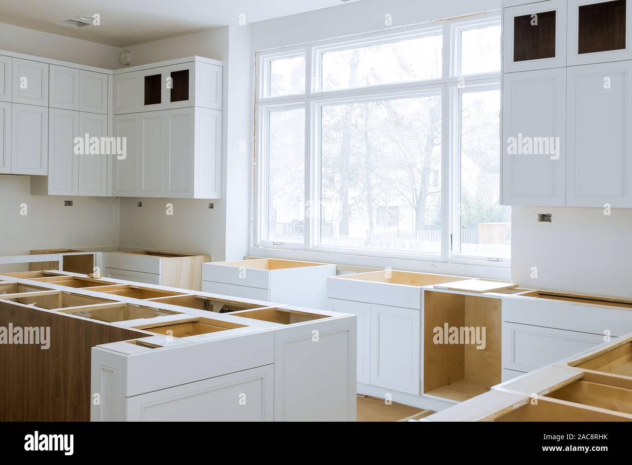 Wooden Cabinets Installation Of In The White Modular Kitchen Of
