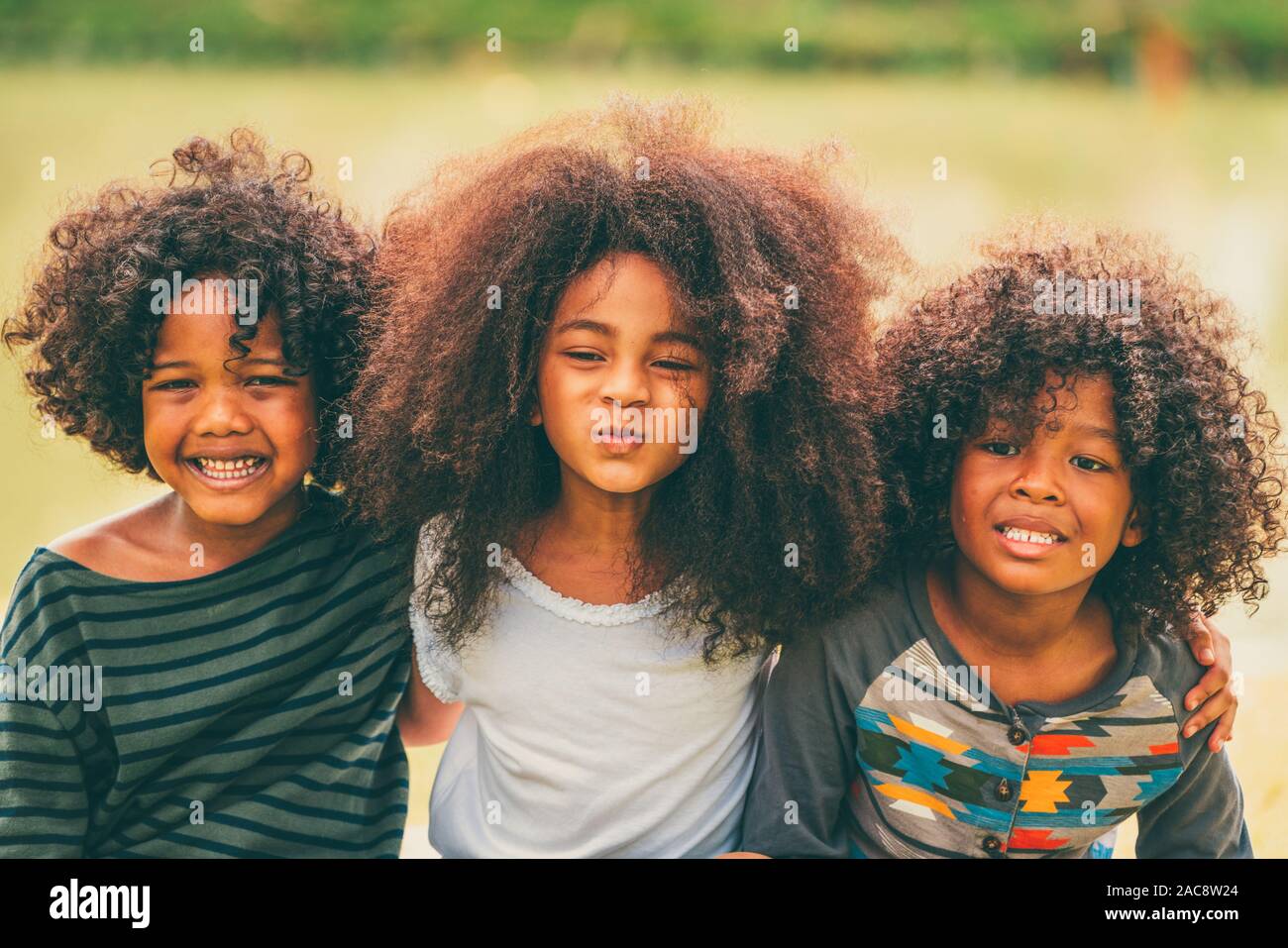 Happy African American Boy And Girl Kids Group Playing In The