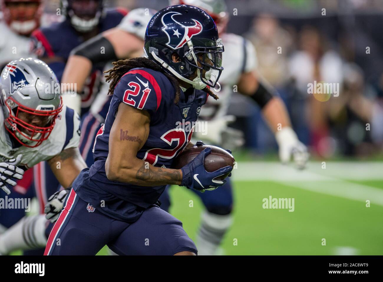 Houston, TX, USA. 1st Dec, 2019. Houston Texans cornerback Bradley Roby (21) runs with the ball after making an interception during the 1st quarter of an NFL football game between the New England Patriots and the Houston Texans at NRG Stadium in Houston, TX. Trask Smith/CSM/Alamy Live News Stock Photo