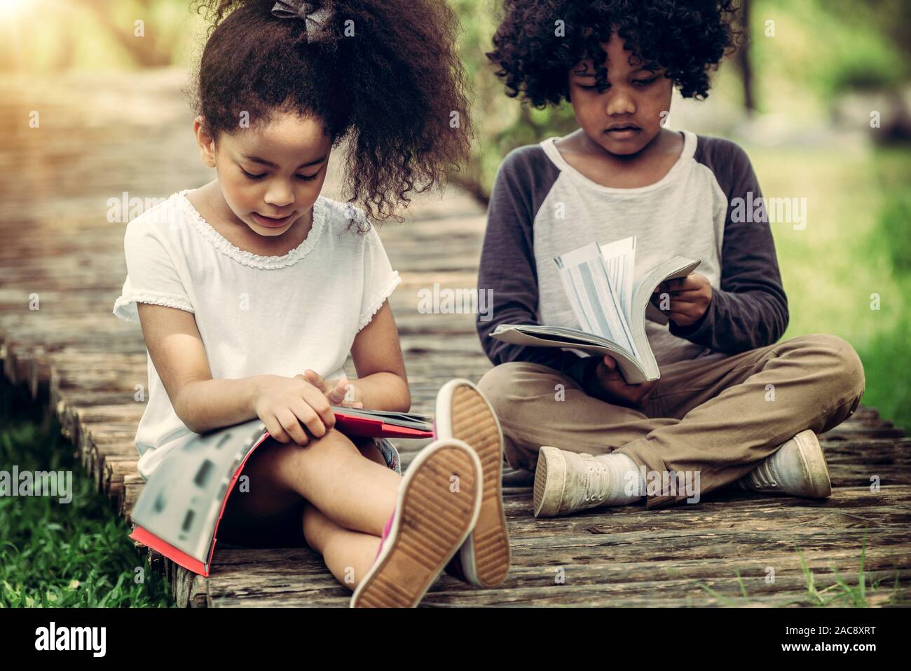 Happy Little Boy And Girl In The Park Two African American