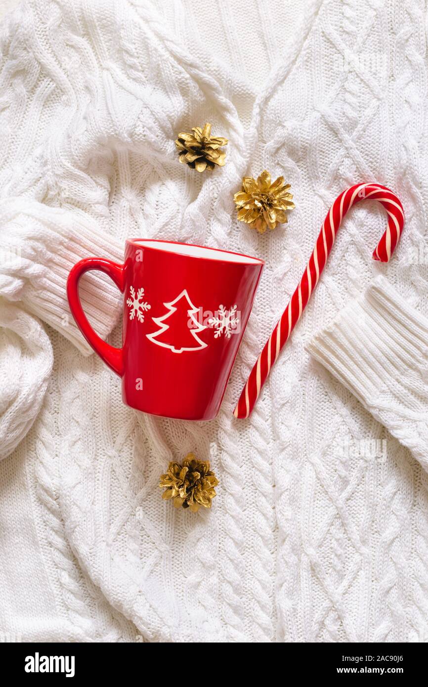 Red Mug And Candy Cane On White Knitted Sweater Christmas Mood Stock Photo Alamy