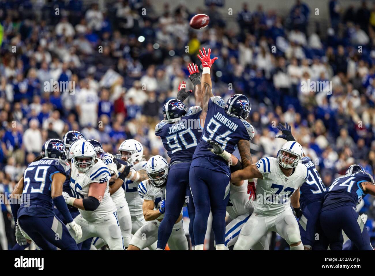 Indianapolis, Indiana, USA. 1st Dec, 2019. Tennessee Titans defensive end DaQuan Jones (90) and Titans nose tackle Austin Johnson (94) try to block an extra point attempt in the second half of the game between the Tennessee Titans and the Indianapolis Colts at Lucas Oil Stadium, Indianapolis, Indiana. Credit: Scott Stuart/ZUMA Wire/Alamy Live News Stock Photo