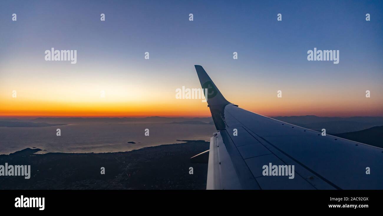 Athens Greece October 14, 2019. Plane approaching Athens, Greece airport at sunset time. Amsterdam Netherlands to Athens Greece Transavia flight Stock Photo