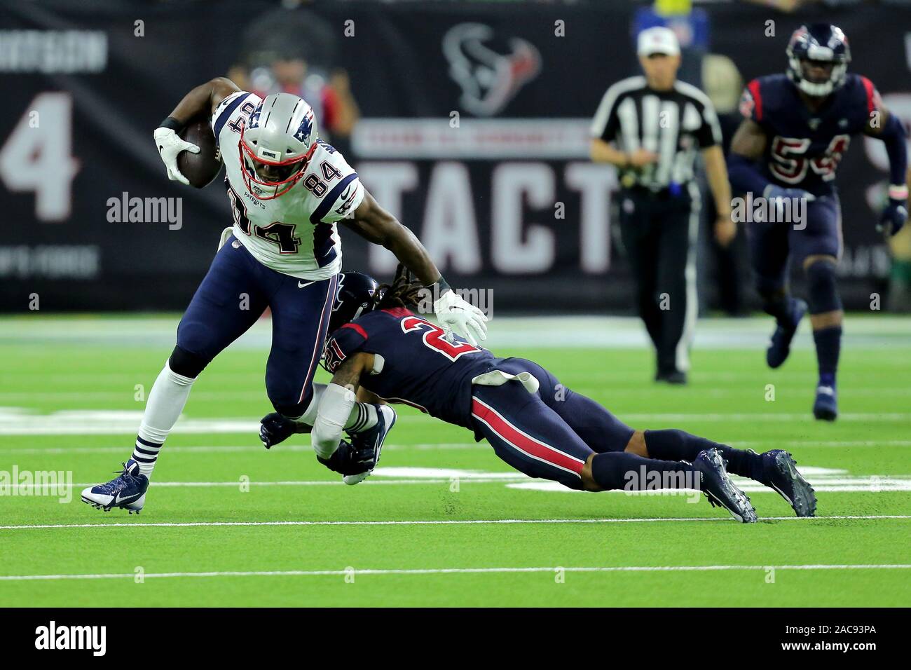 Houston, Texas, USA. 1st Dec, 2019. New England Patriots tight end Benjamin Watson (84) is tackled low by Houston Texans cornerback Bradley Roby (21) after a pass reception during the third quarter of the NFL regular season game between the Houston Texans and the New England Patriots at NRG Stadium in Houston, TX on December 1, 2019. Credit: Erik Williams/ZUMA Wire/Alamy Live News Stock Photo