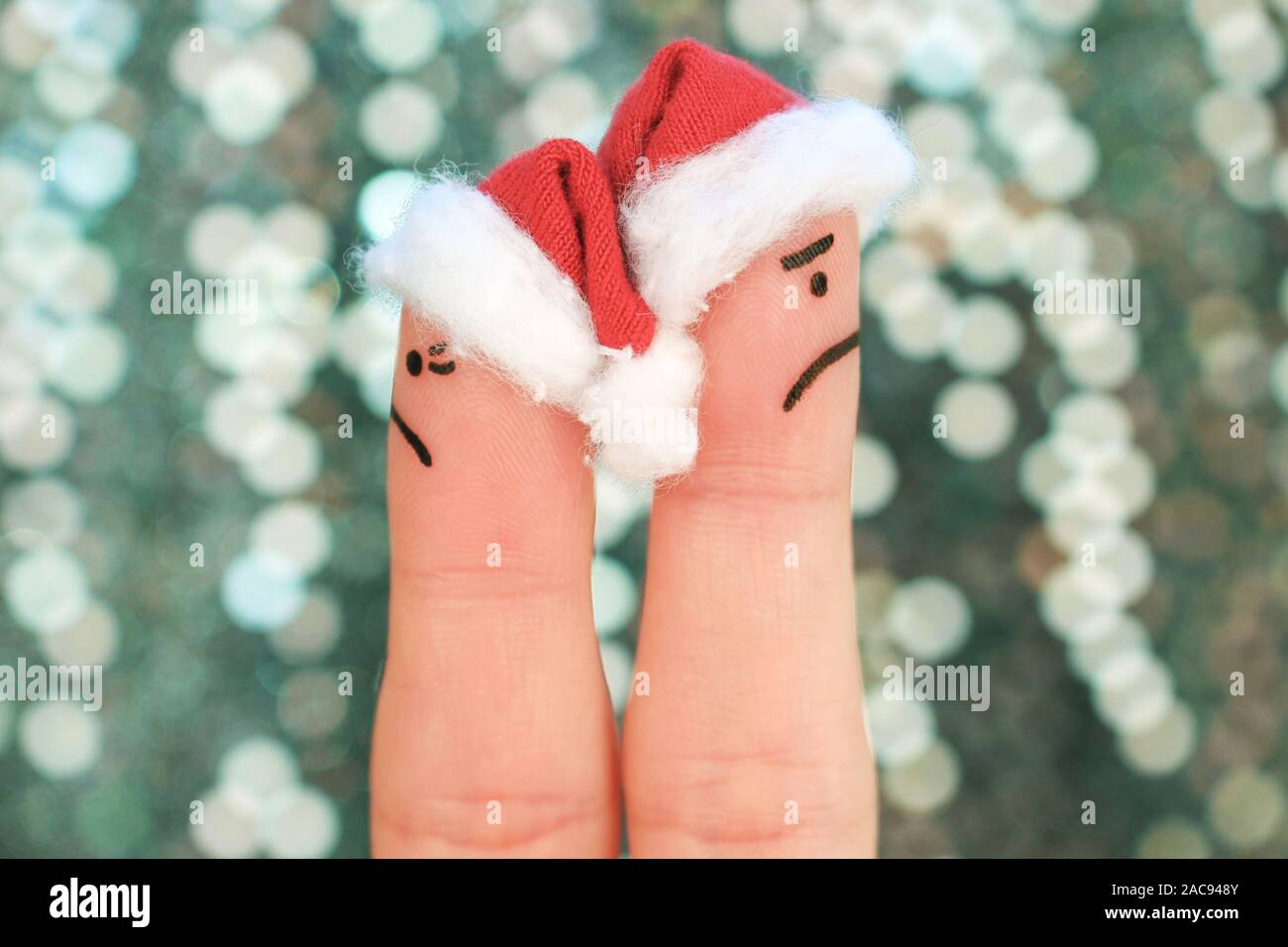 Fingers art of couple celebrates Christmas. Concept of man and woman during quarrel in New Year. Couple after an argument looking in different directi Stock Photo