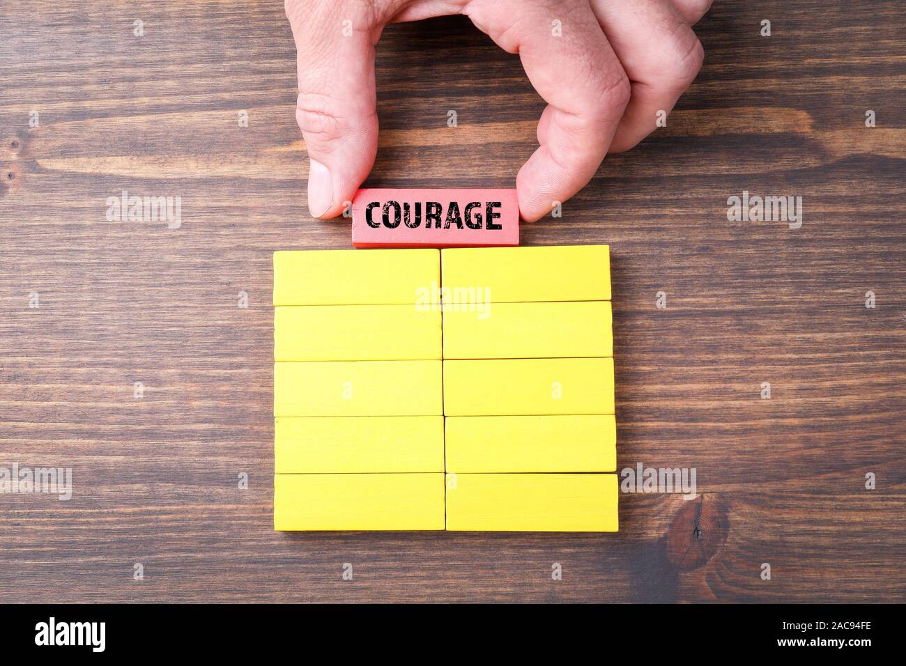 Courage. Leadership, responsibility, inspiration and motivation concept. Colorful Wooden Blocks Stock Photo