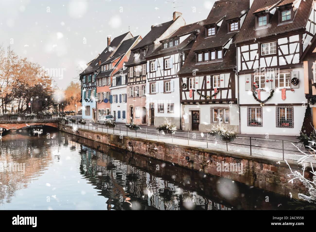 Colmar, France in winter snowstorm. Historical buildings along canal in the  city center in snowy weather. Magic Christmas mood. Monochromatic neutral  Stock Photo - Alamy