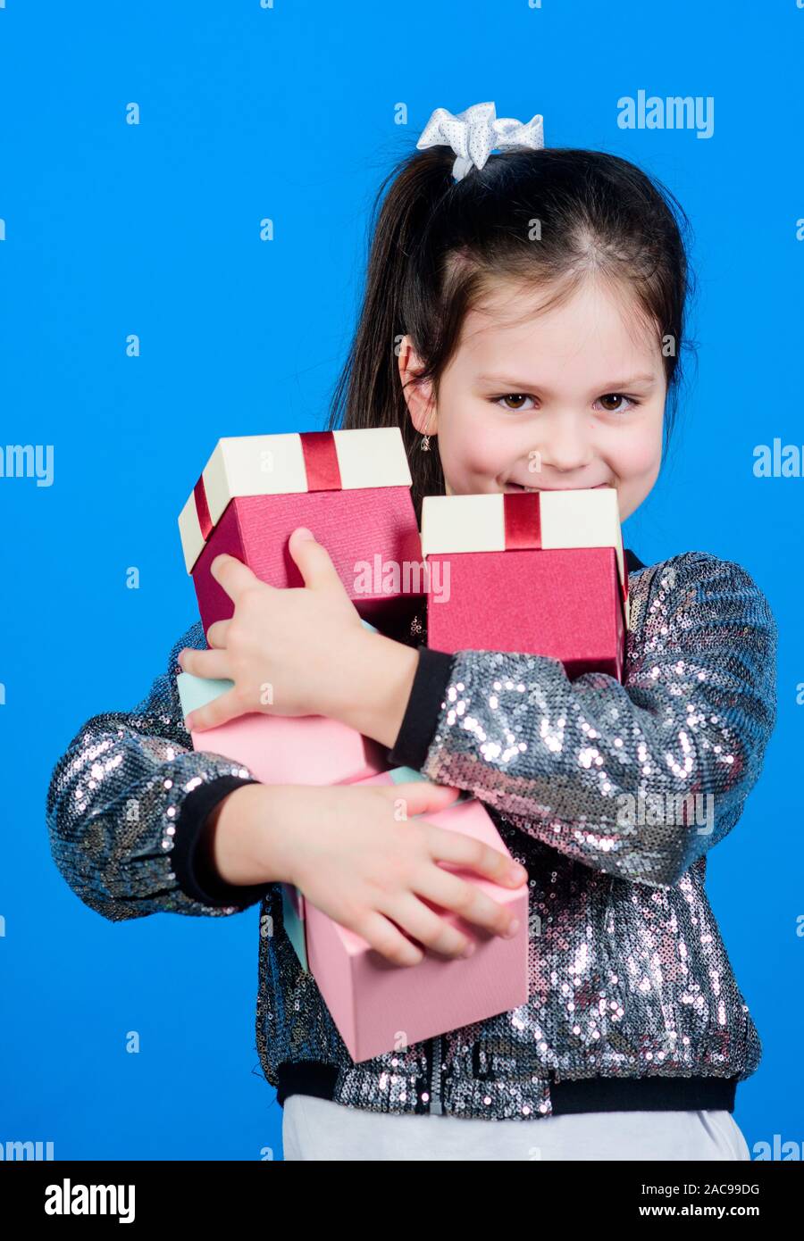 Shopping day. Child carry lot gift boxes. Surprise gift box. Birthday wish list. World of happiness. Only for me. Special happens every day. Girl with Stock Photo