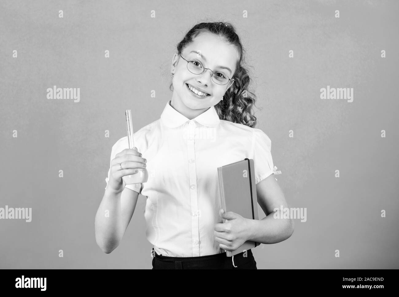 Good news. science research in lab. Small school girl. child study bilogy lesson with note. small smart girl with testing flask. education and knowled Stock Photo