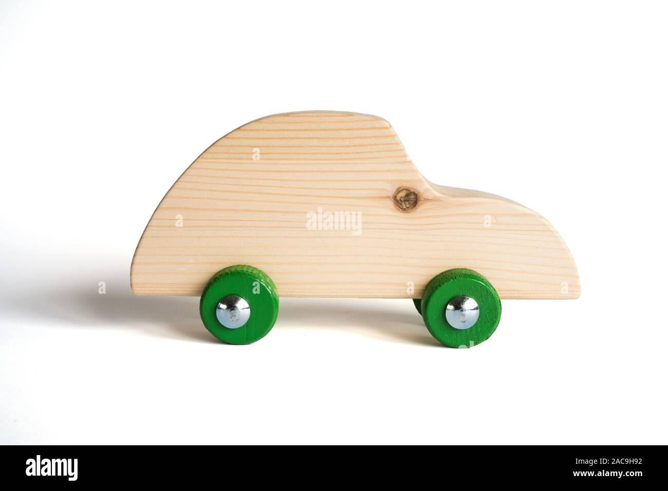 Handmade wooden toy car on white background Stock Photo - Alamy