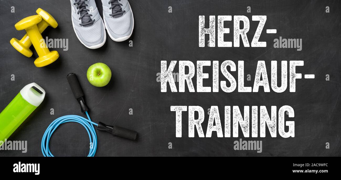 Fitness equipment on a dark background - Cardiovascular Workout - Herz-Kreislauf-Training (German) Stock Photo