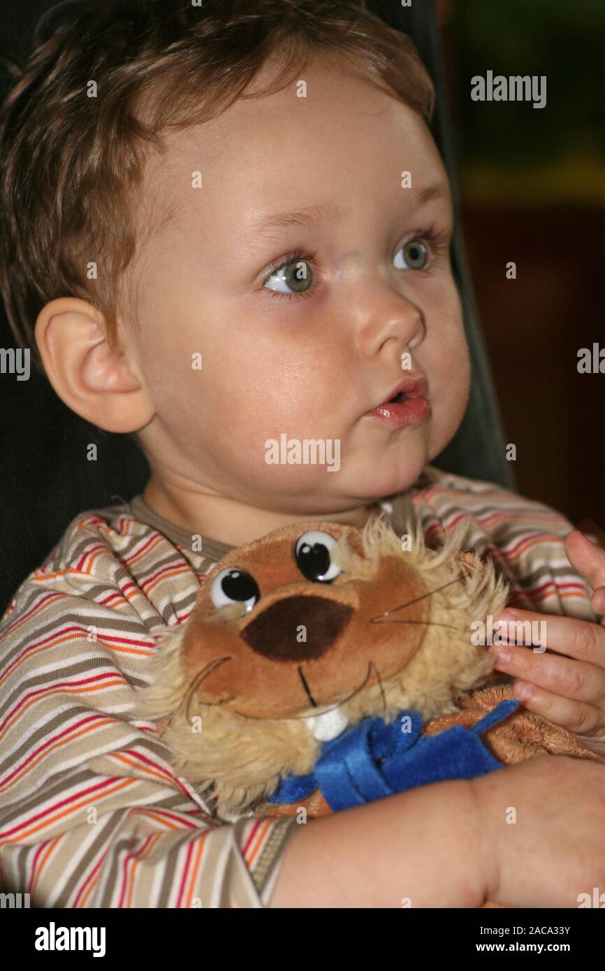 Child with plush animal Stock Photo