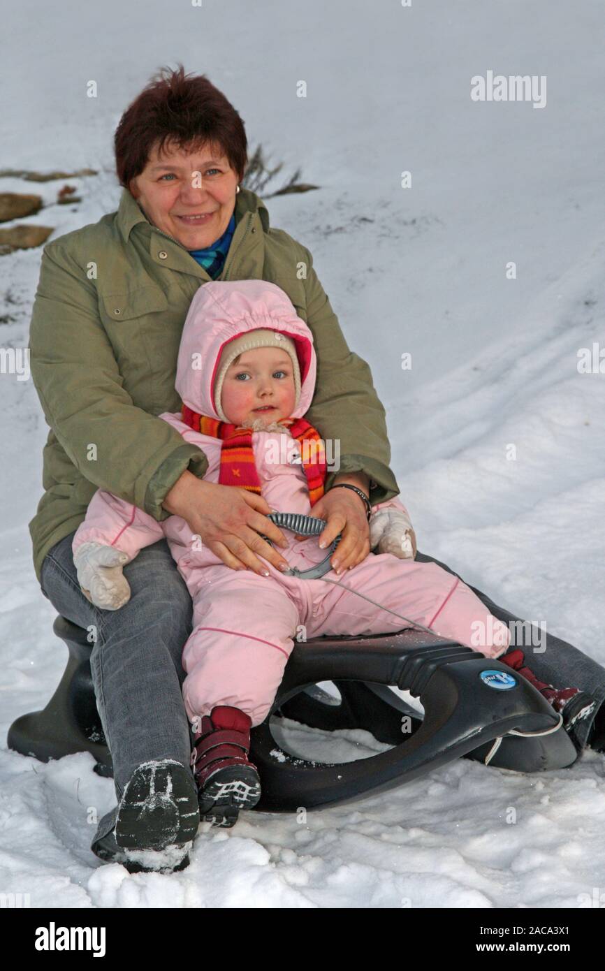 Sleigh ride Grandma with grandson Stock Photo