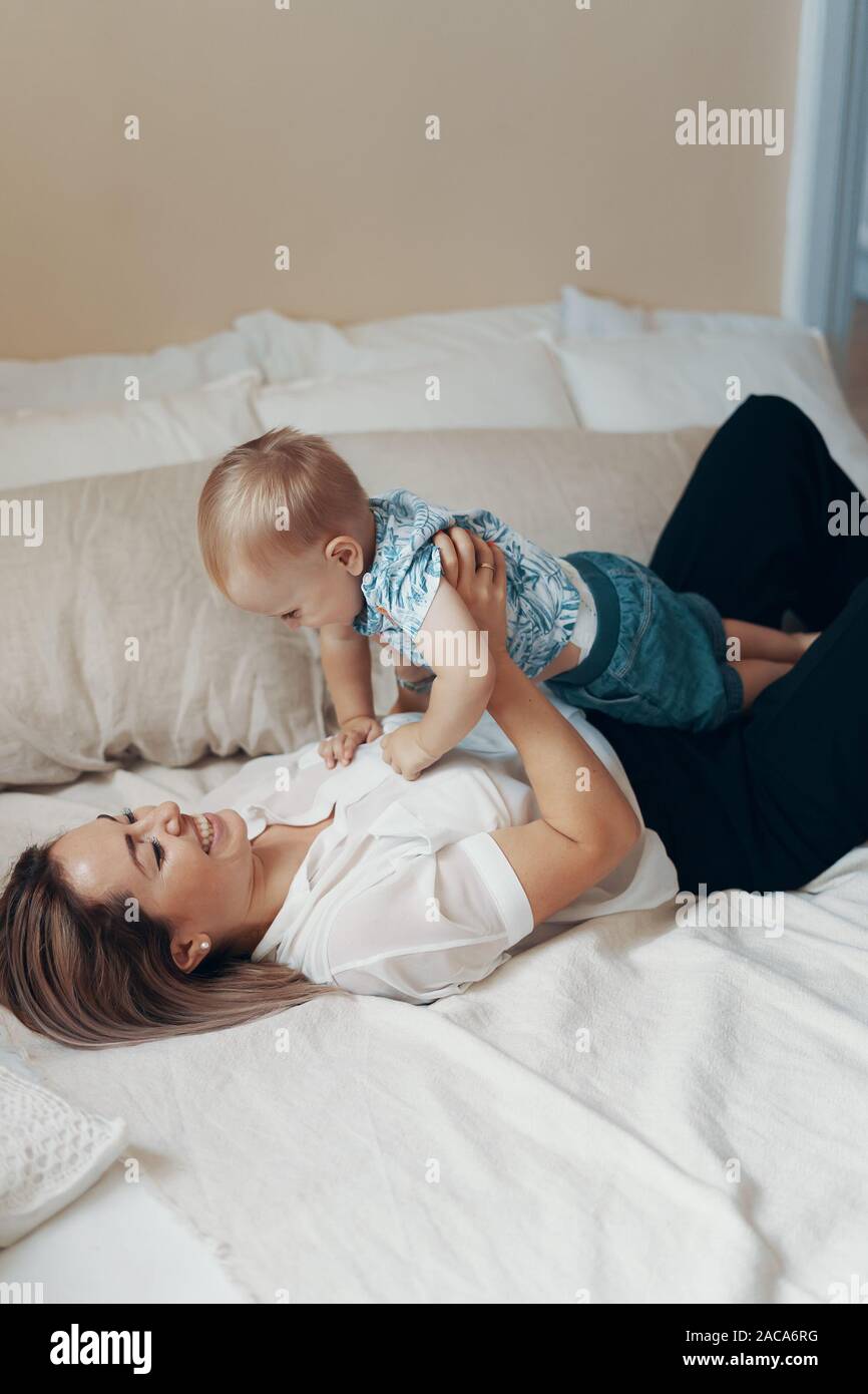 Young Mother Having Fun Laughing Playing Funny Active Games