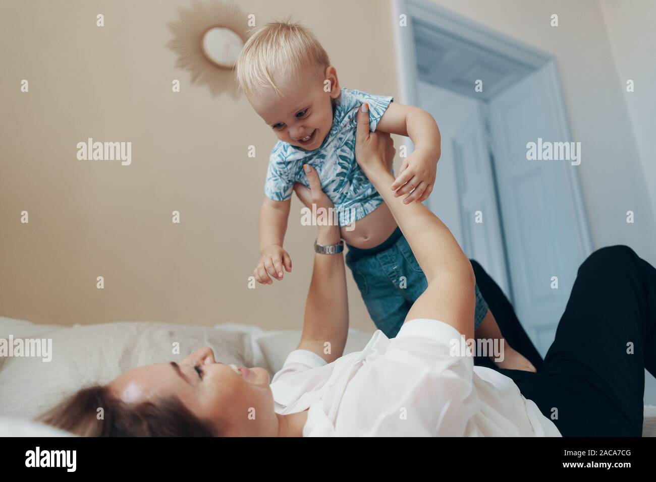 Young Mother Having Fun Laughing Playing Funny Active Games