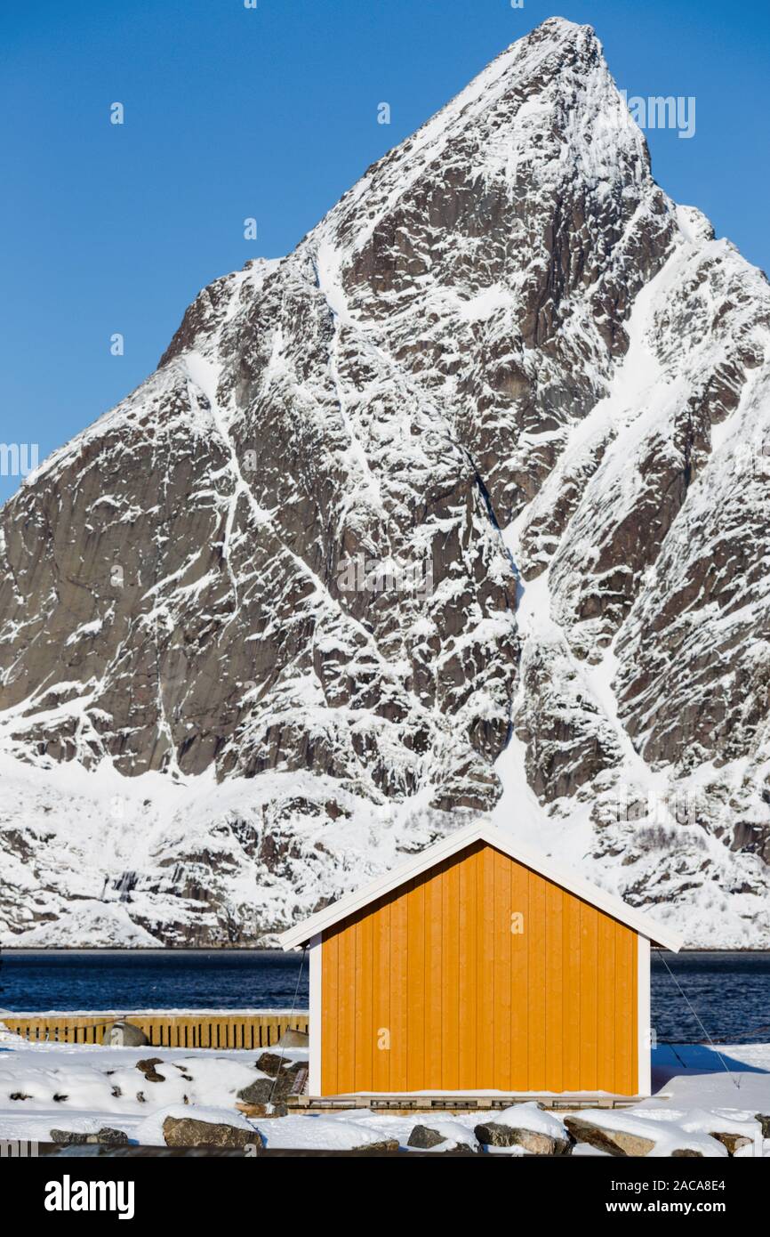 traditional norwegian wooden house rorbu to stand on the shore of the