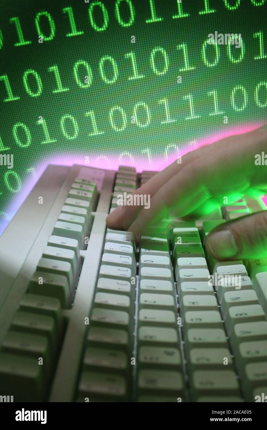 Computer keyboard with hand and numeric code Stock Photo