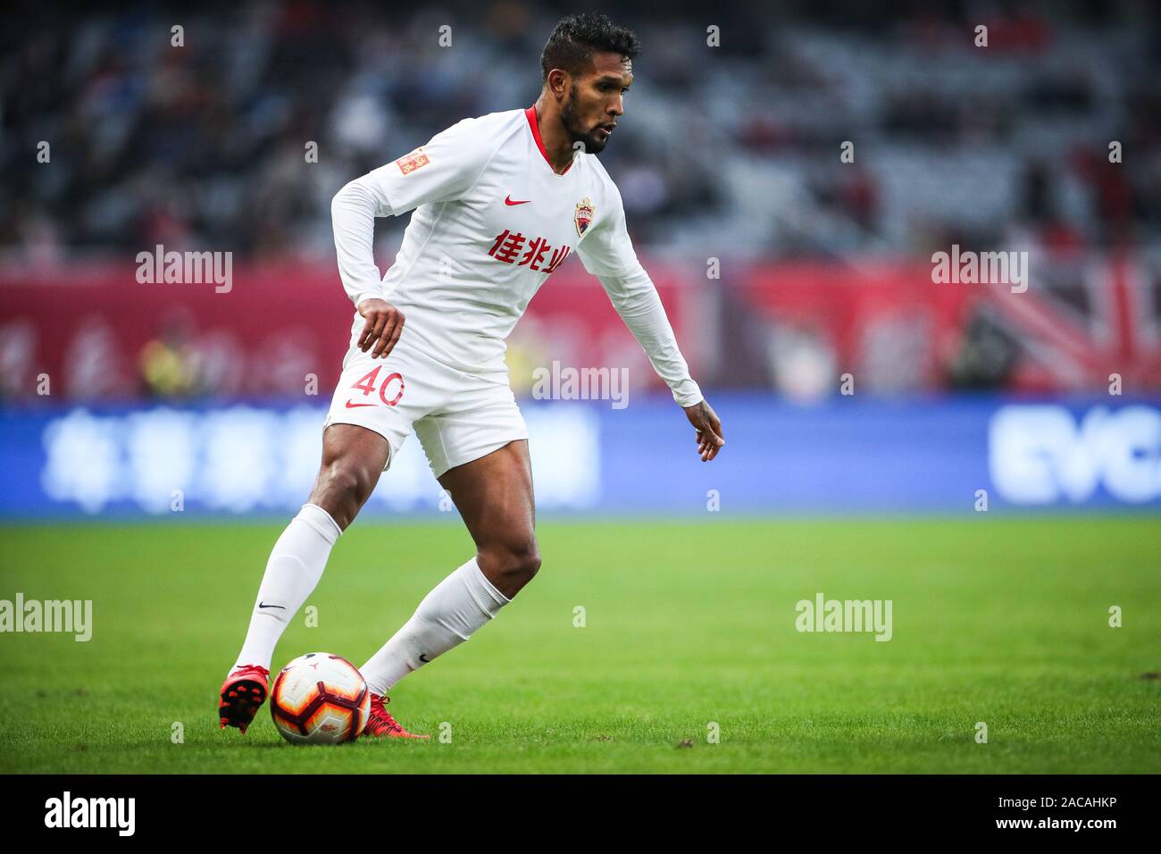 Brazilian-born Portuguese football player Dyego Sousa of Shenzhen F.C. keeps the ball during the 30th round match of Chinese Football Association Super League (CSL) against Shanghai SIPG in Shanghai, China, 1 December 2019. Shanghai SIPG slashed Shenzhen F.C. with 6-0. Stock Photo