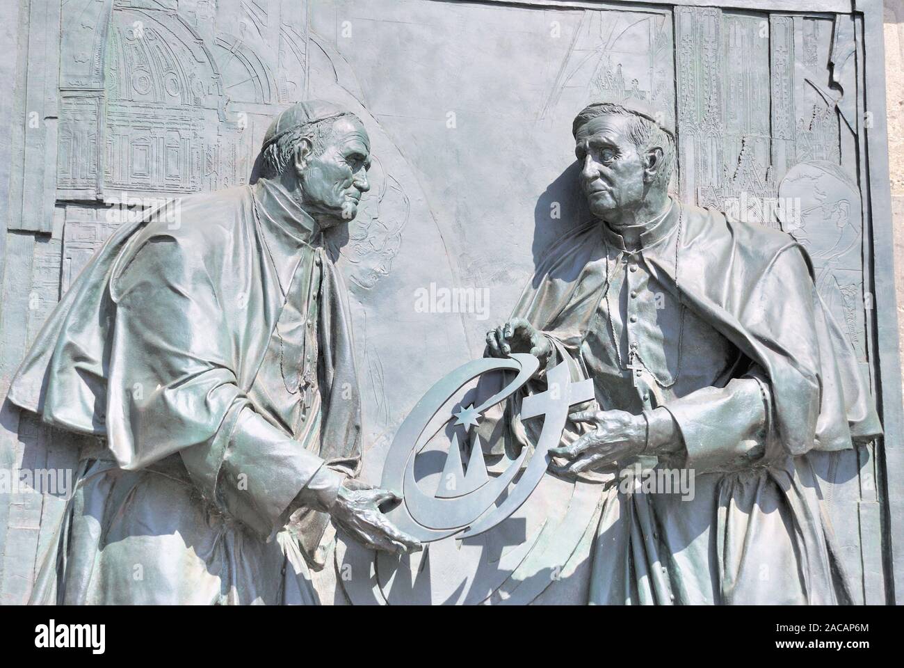 Pope John Paul II presents his successor Pope Benedict XVI with the World Youth Day Cross, bronze relief by the Düsseldorf arti Stock Photo