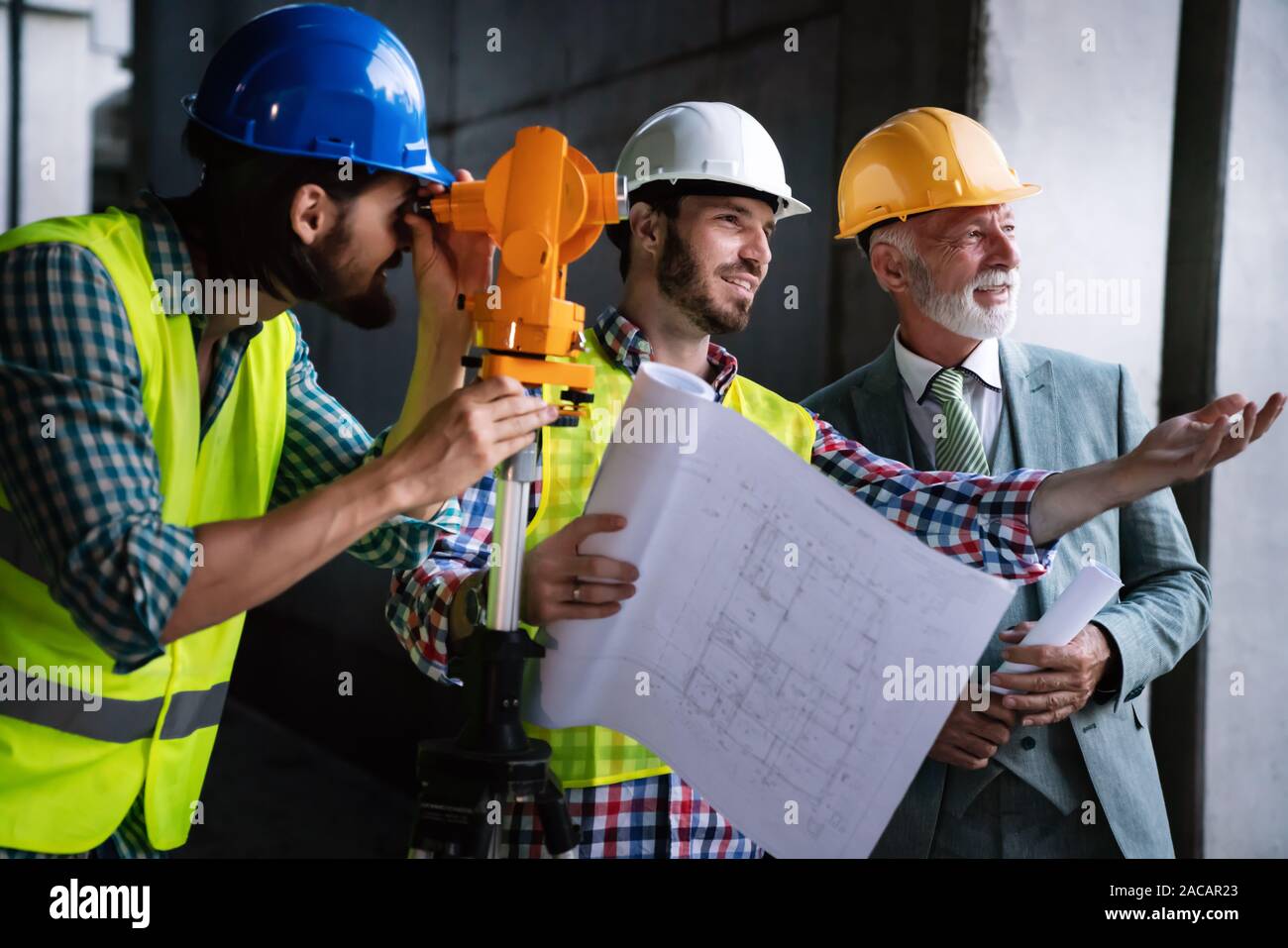 Engineer, contractor, architect teamwork. Construction people talking and planning work, blueprint Stock Photo