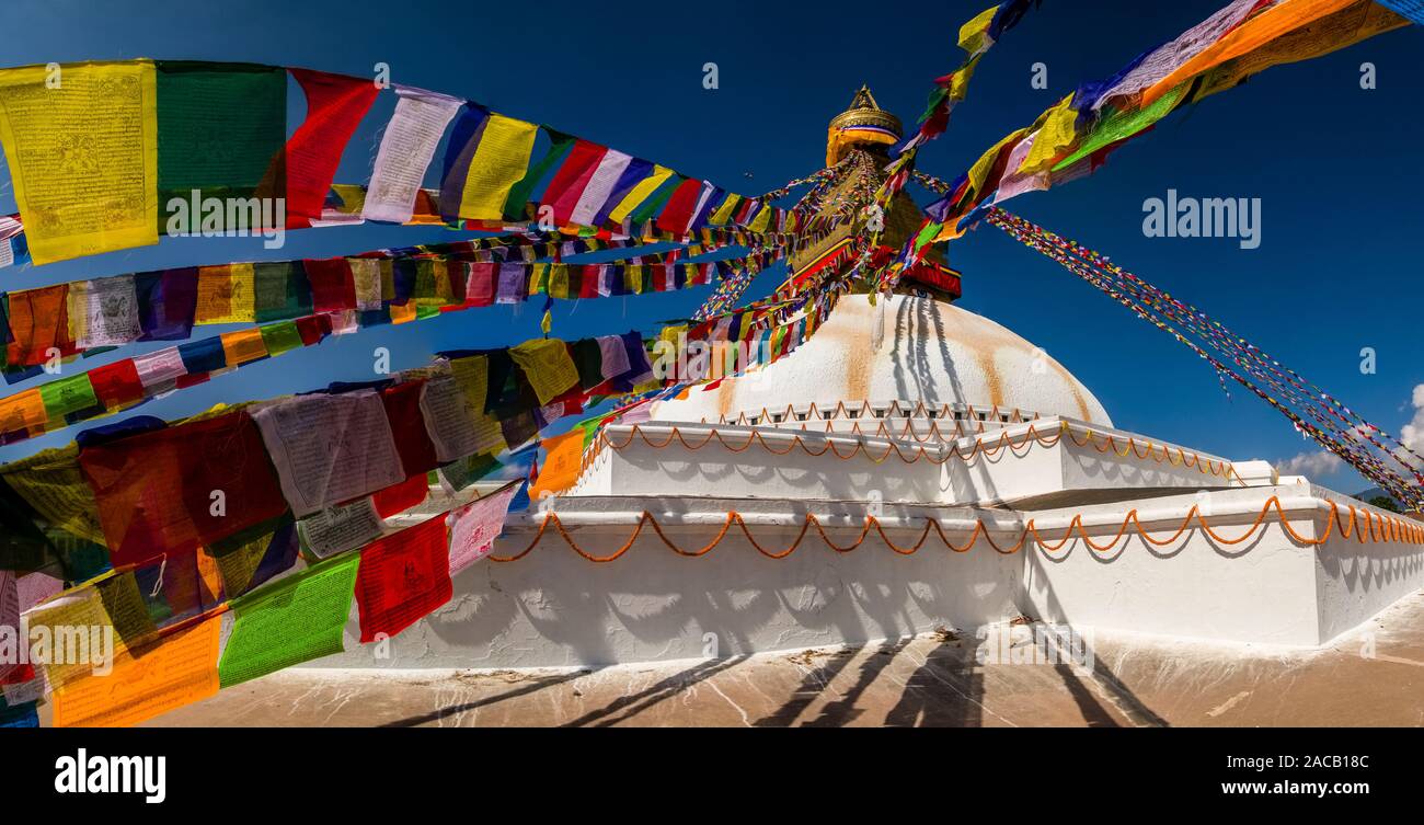 Panoramic view of the Boudha Stupa in the suburb Boudhanath, decorated with colorful buddhist prayer flags Stock Photo