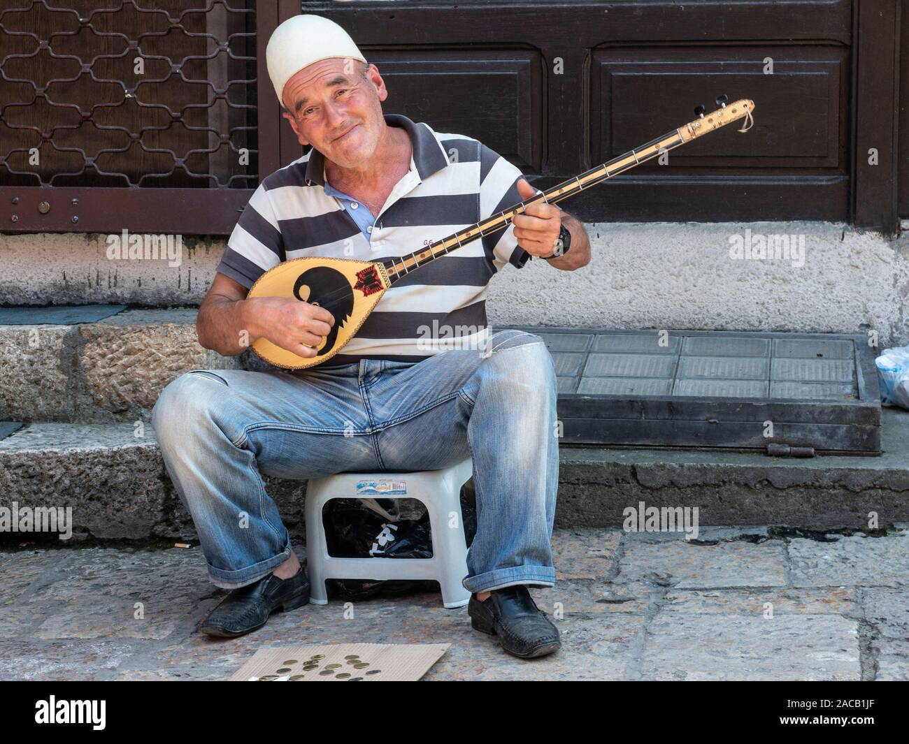 A man playing his Tambura in Skopje in North Macedonia Stock Photo Alamy