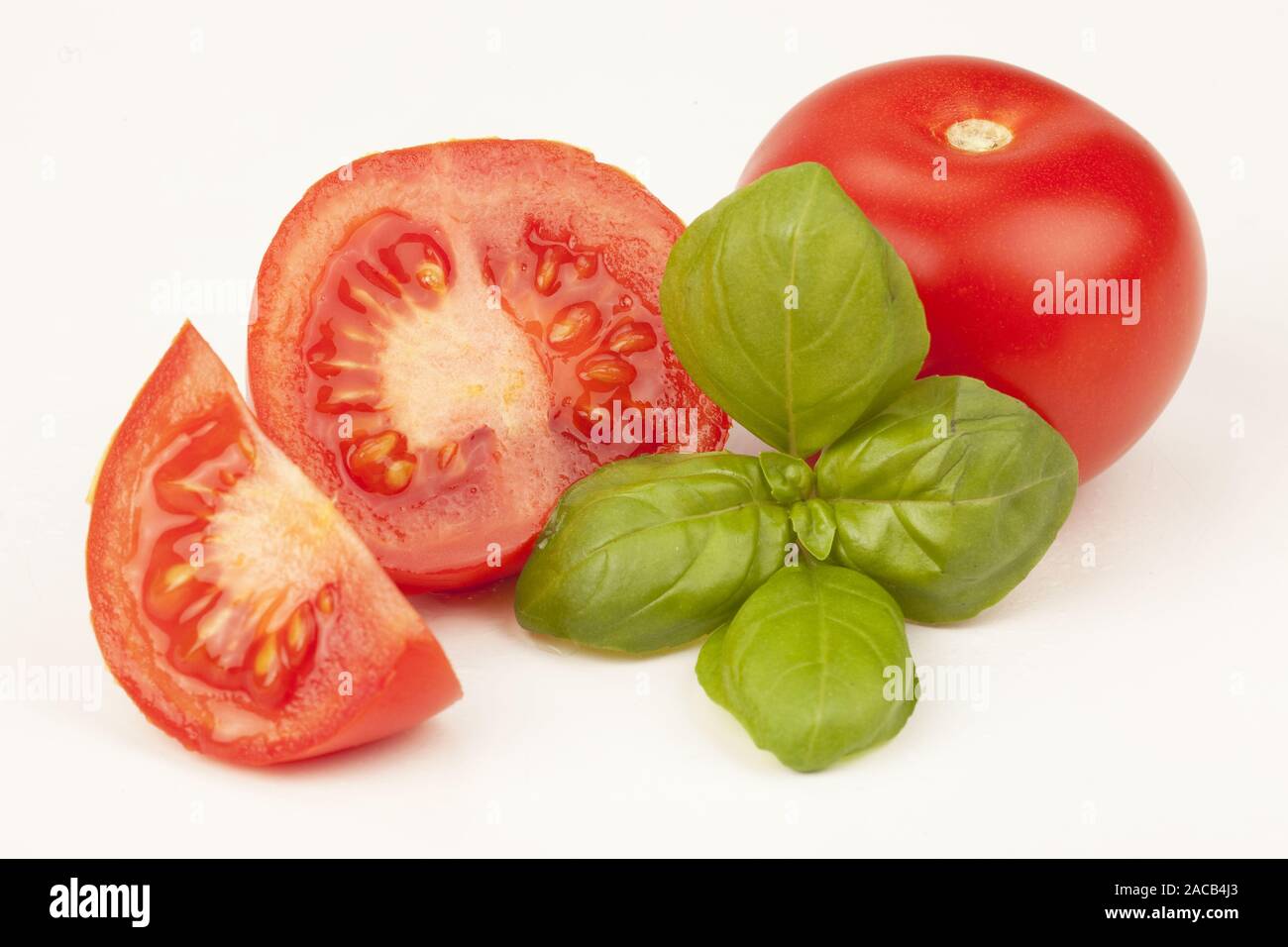 Tomatoes with basil Stock Photo - Alamy