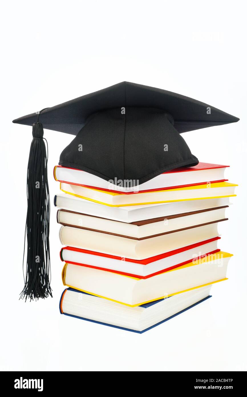 Doctor's hat on a book stack Stock Photo - Alamy