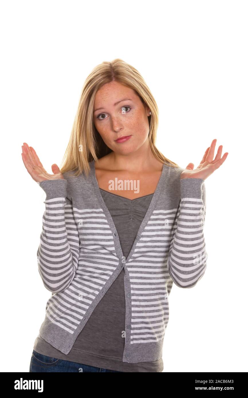 a clueless woman shrugs her shoulders Stock Photo Alamy