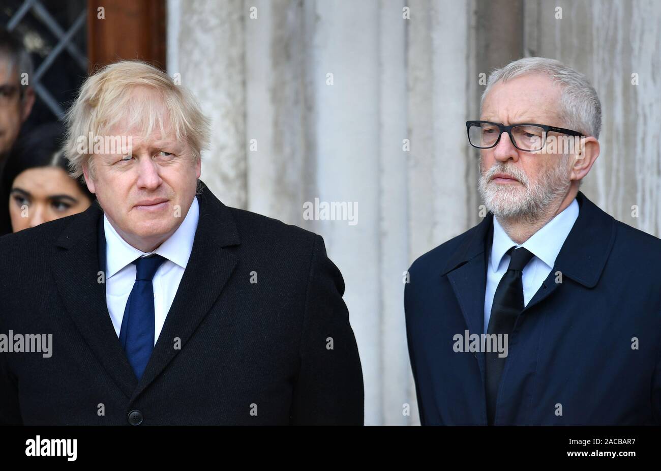 Prime Minister Boris Johnson (left) and Labour leader Jeremy Corbyn take part in a vigil in Guildhall Yard, London, to honour the victims off the London Bridge terror attack, as well as the members of the public and emergency services who risked their lives to help others after a terrorist wearing a fake suicide vest went on a knife rampage killing two people, was shot dead by police on Friday. Stock Photo